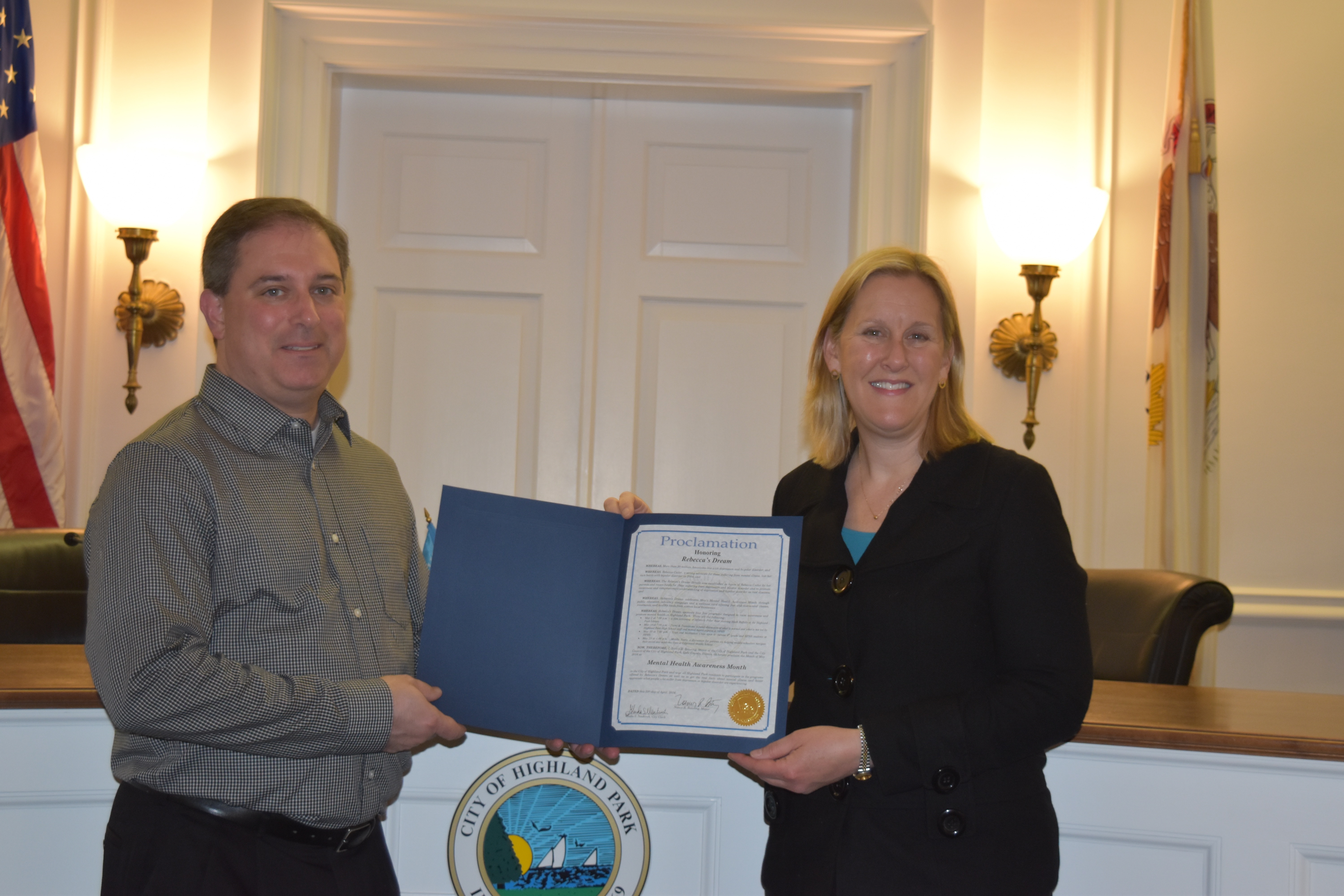 Brett Cutler accepting a Proclamation from Mayor Nancy R. Rotering, Mayor of Highland Park
